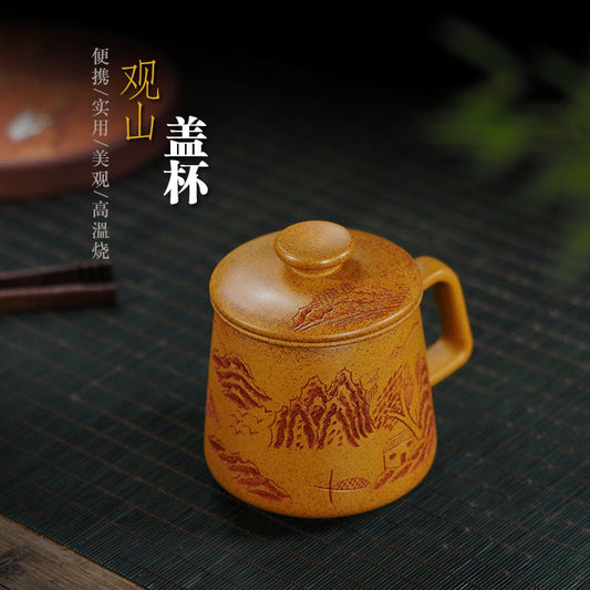 Handmade Yixing purple sand cup with lid, featuring mountain view design, large capacity, perfect for tea lovers.