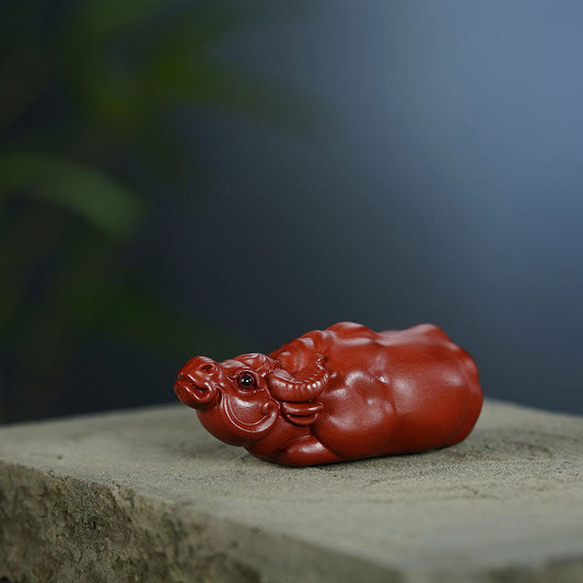 Handmade Yixing purple sand tea pet in the shape of a cattle, perfect for home decor and tea ceremonies.