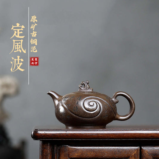 Handmade Yixing purple sand teapot with intricate design, showcasing artisanal craftsmanship for elegant tea ceremonies.