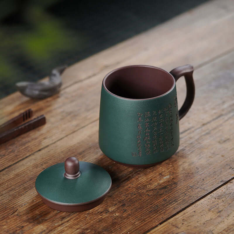 Handmade Yixing purple sand tea cup with cover, featuring unique craftsmanship and original purple sand styling.