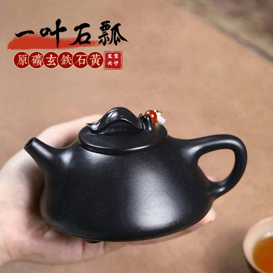 Handmade Yixing purple sand teapot crafted from mineral black iron stone, perfect for Kung Fu tea ceremonies.