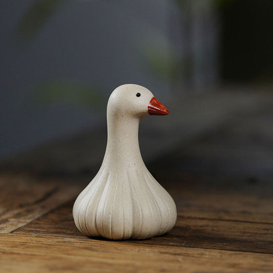 Handmade Yixing purple sand tea pet ornament in the shape of a goose, perfect for tea table decoration.