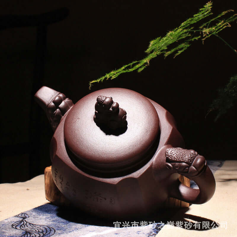 Handmade Yixing original purple sand teapot with intricate carvings and elegant design, perfect for Kung Fu tea ceremonies.