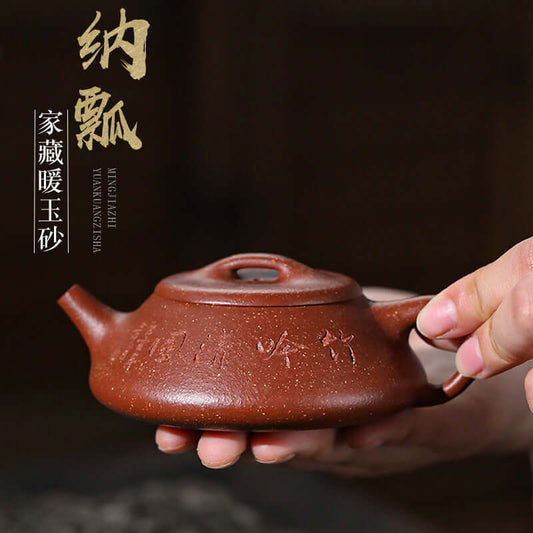 Handmade Yixing purple sand teapot with elegant design, showcasing traditional craftsmanship and unique texture.