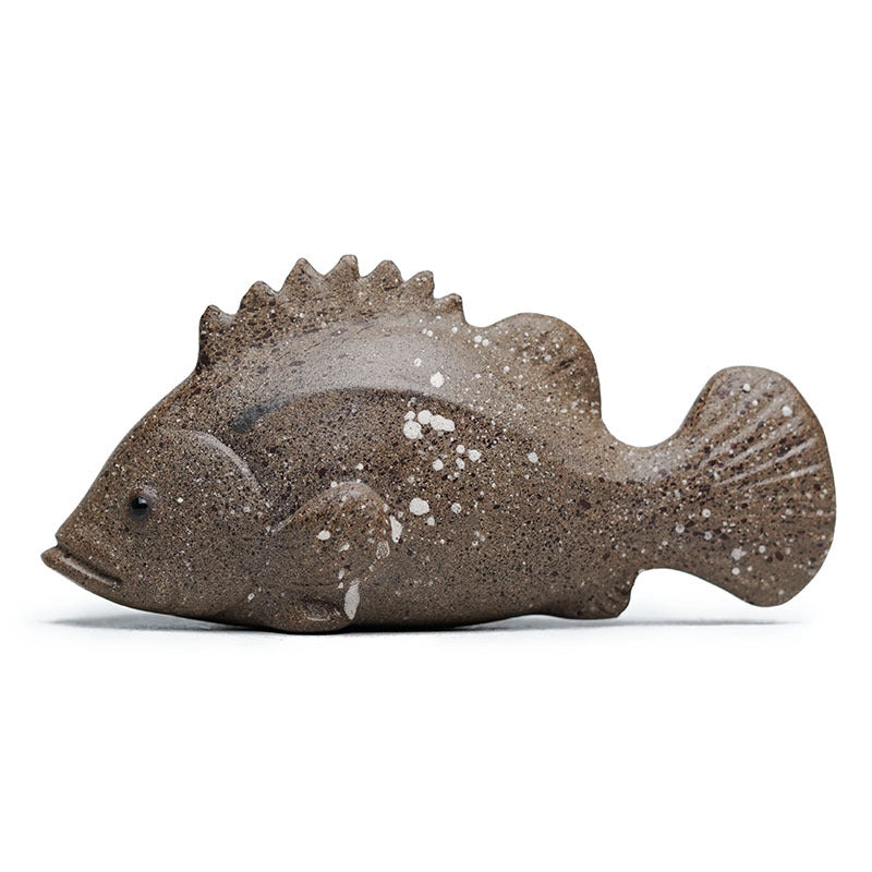 Handmade Yixing purple sand tea pet model of a mandarin fish, crafted by skilled artisans for tea enthusiasts.