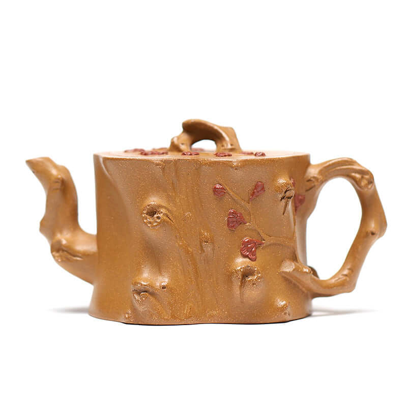 Handmade Yixing purple sand teapot in plum stump shape with floral design, perfect for Kung Fu tea sets.