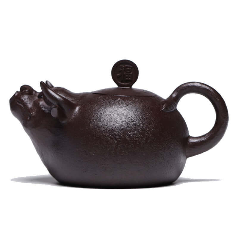 Handmade Yixing purple sand teapot shaped like a bull, showcasing traditional craftsmanship and elegant design.
