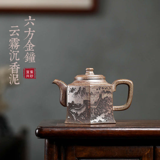 Handmade Yixing purple sand teapot with intricate mountains design, perfect for Kung Fu tea sets, original craftsmanship.