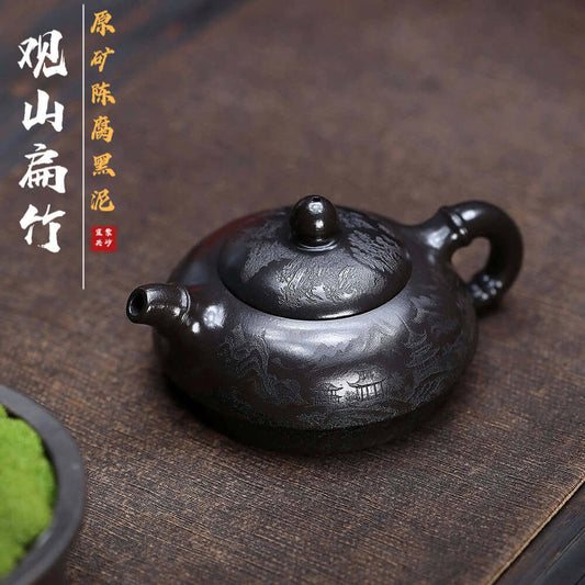 Handmade Yixing purple sand teapot with intricate design, perfect for kung fu tea sets and authentic brewing.