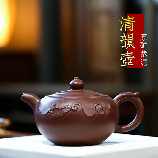 Handmade Yixing purple sand teapot featuring intricate design, crafted from raw ore purple mud, showcasing elegance and tradition.