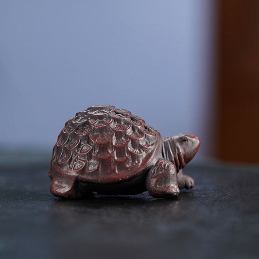 Handmade Yixing purple sand turtle ornament crafted from original purple sand for home office decoration.