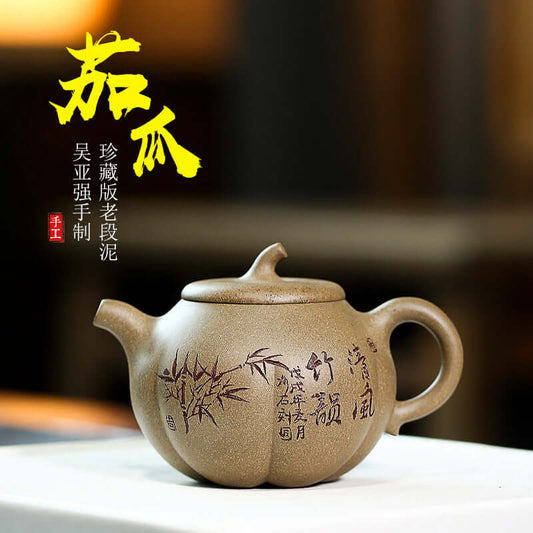 Handmade Yixing purple sand teapot with bamboo design, crafted by Wu Yaqiang, showcasing artistic details.