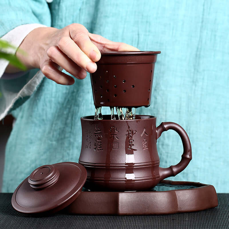 Handmade Yixing purple sand teapot being used, featuring intricate design and brewing process.