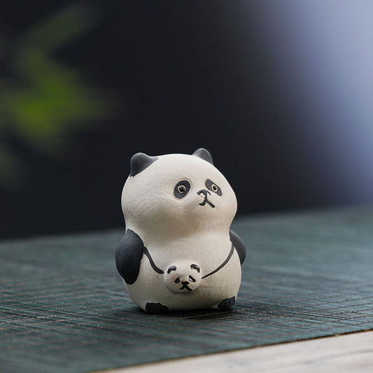 Handmade Yixing purple sand giant panda ornament, cute ceramic tea pet for tea lovers, unique craft decor.