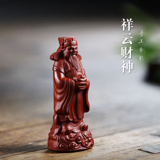 Handmade purple clay God of Wealth ornament, featuring red robe and intricate details, ideal for tea set decoration.