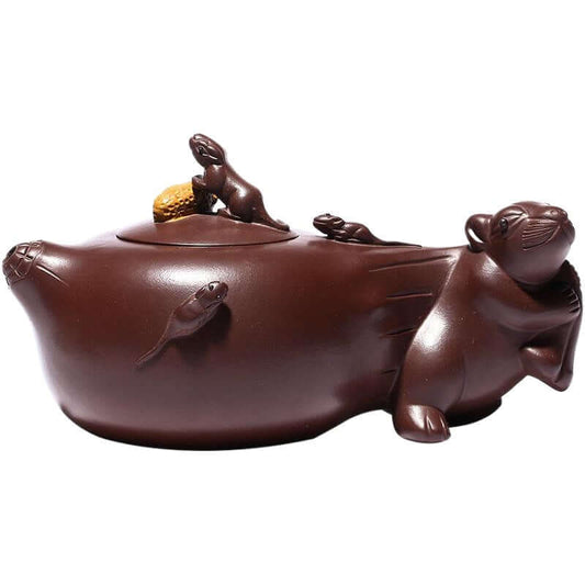 Handmade Yixing purple sand teapot featuring intricate mouse designs, symbolizing prosperity and luck.