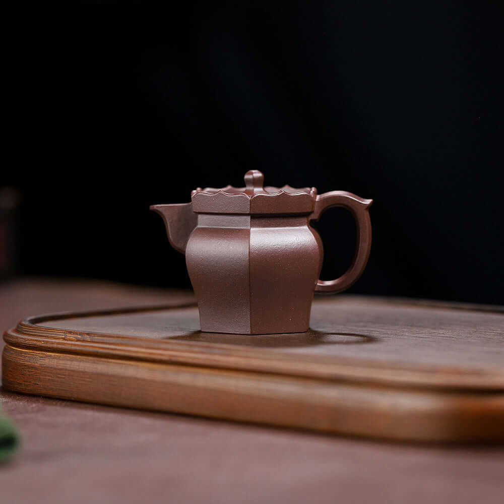 Handmade Yixing purple sand teapot with elegant design, perfect for tea sets. Original craftsmanship and high-end quality.