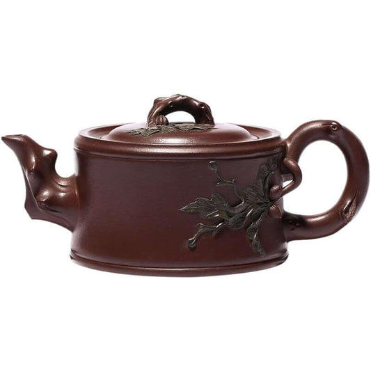 Handmade Yixing purple sand teapot with intricate leaf design, showcasing traditional craftsmanship and unique aesthetics.