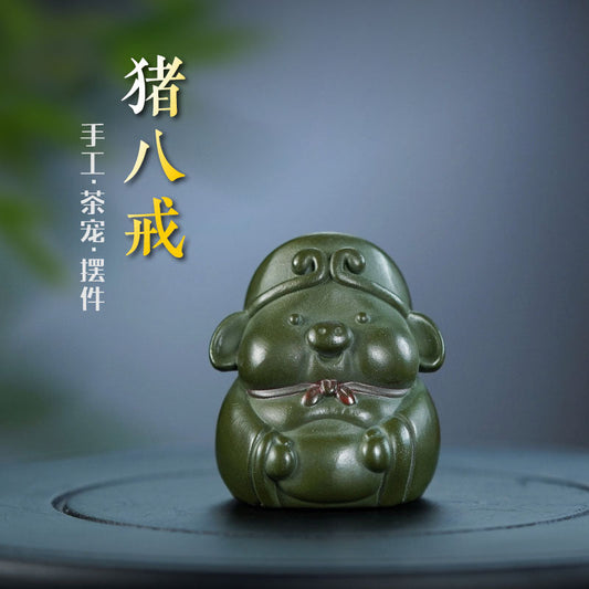 Handmade Yixing purple sand pig sculpture, creative tea pet ornament for tea tables, crafted by Yixing artisans.