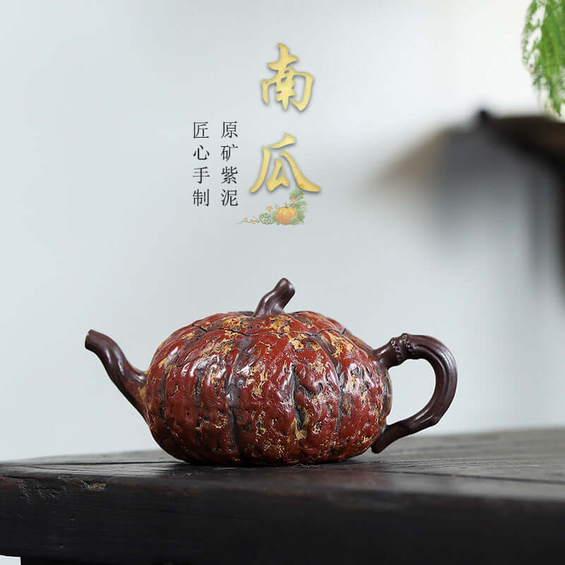 Handmade Yixing purple sand teapot shaped like a pumpkin, showcasing original purple clay craftsmanship.