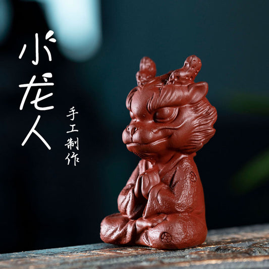 Handmade Yixing purple sand little dragon man ornament, perfect for tea sets and gift giving.