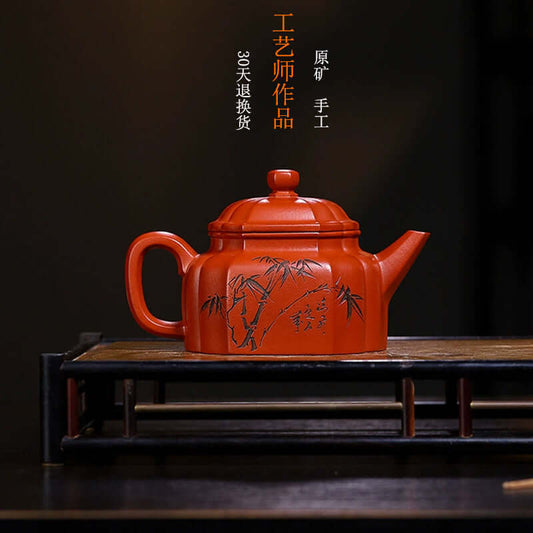 Handmade Yixing purple sand teapot with bamboo design, crafted by skilled artisans for tea enthusiasts.