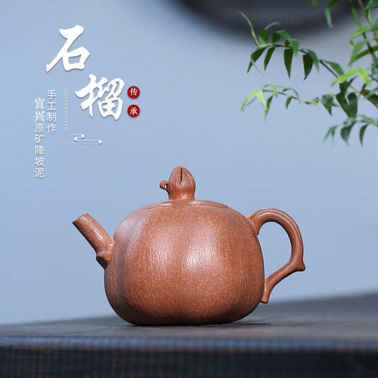Handmade Yixing purple sand teapot with pomegranate shape, crafted from original raw ore clay.
