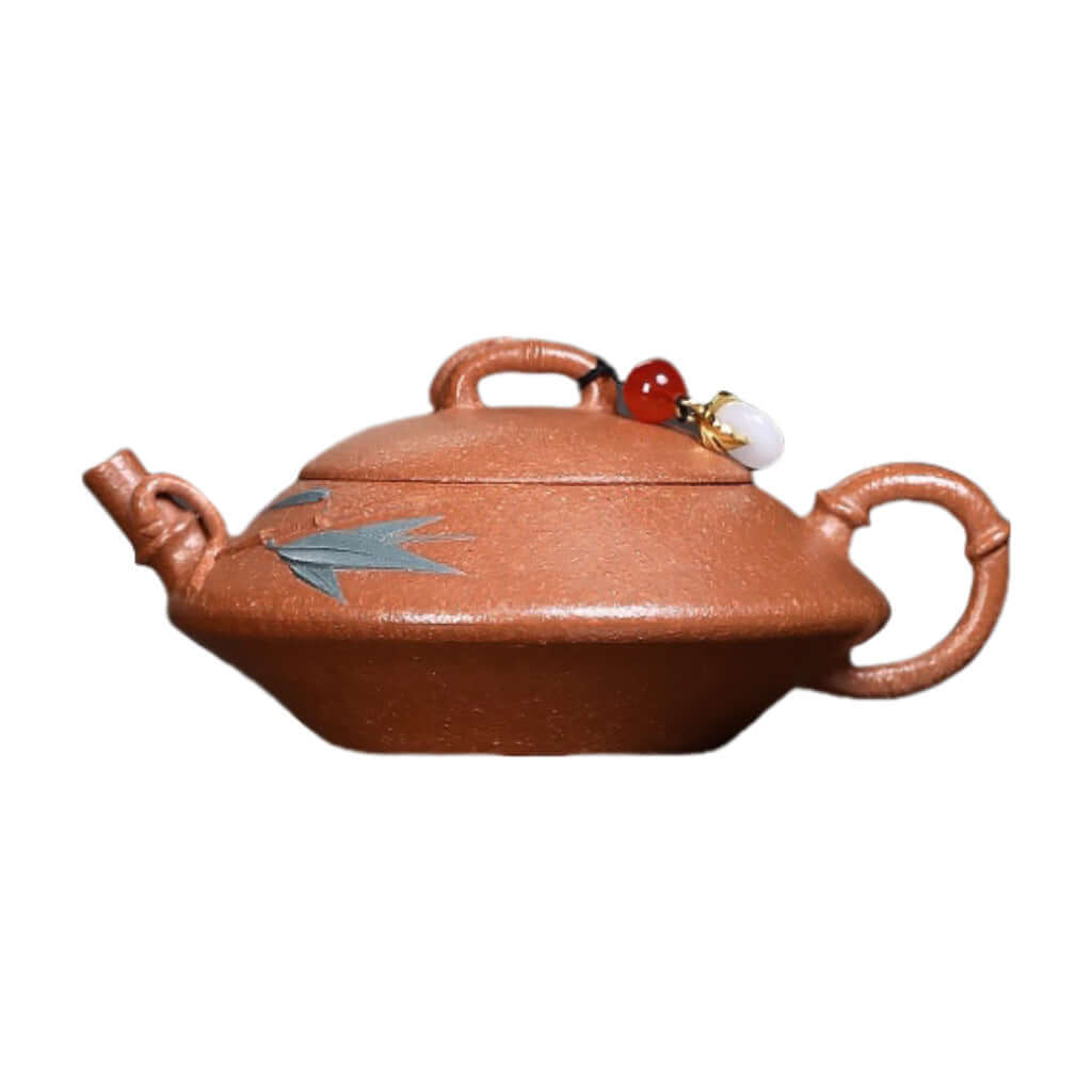 Handmade Yixing purple sand teapot with bamboo design, perfect for Kung Fu tea ceremonies, original craft from Yixing.