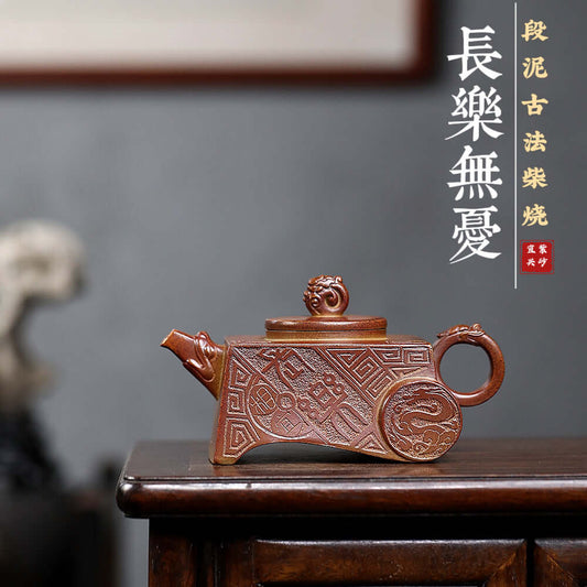 Handmade Yixing purple sand teapot crafted from raw ore, showcasing ancient techniques and intricate designs.