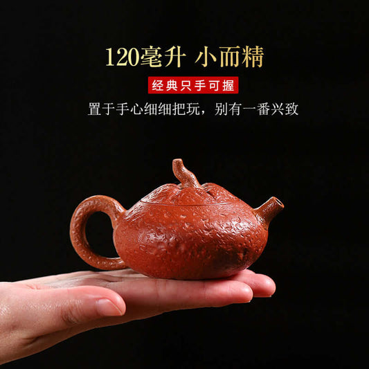Handmade Yixing purple sand teapot shaped like an orange, 120cc capacity, showcasing fine craftsmanship and unique design.