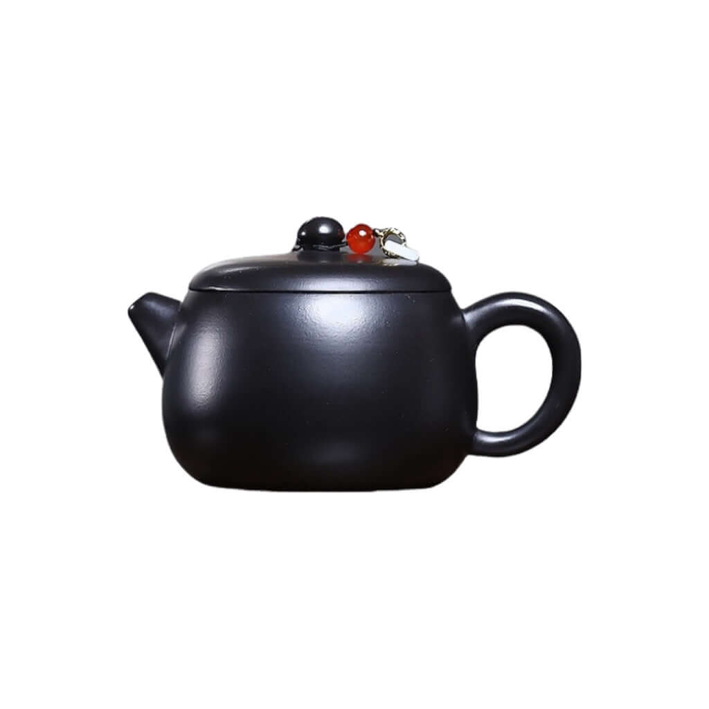 Handmade Yixing purple sand teapot with burnt gray finish and jade bead, perfect for Kung Fu tea sets.