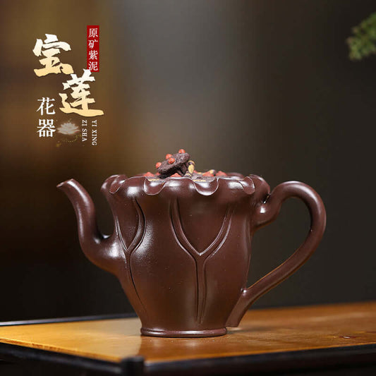Handmade Yixing purple sand teapot with lotus design, showcasing elegant craftsmanship and rich purple clay.