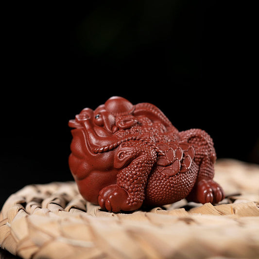 Handmade Yixing purple sand tea pet ornament, featuring a unique design, perfect for tea sets and gifts.
