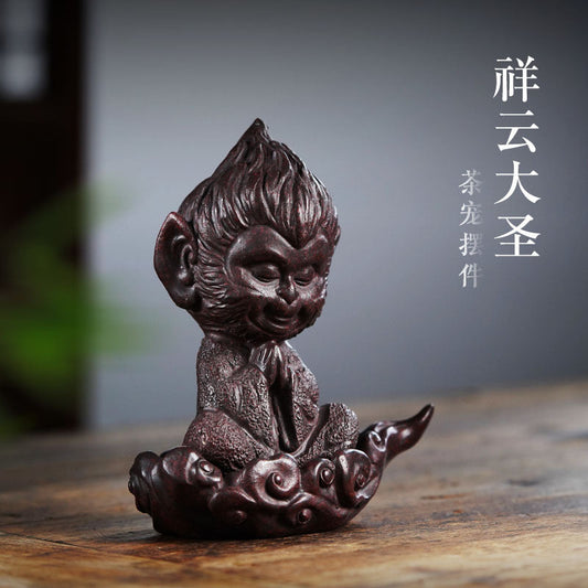 Handmade Yixing purple sand Sun Wukong ornament, unique tea pet sculpture for desktop tea table decor.