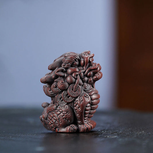 Handmade Yixing purple sand Kirin tea pet, a portable ornament for tea lovers, showcasing original purple clay craftsmanship.