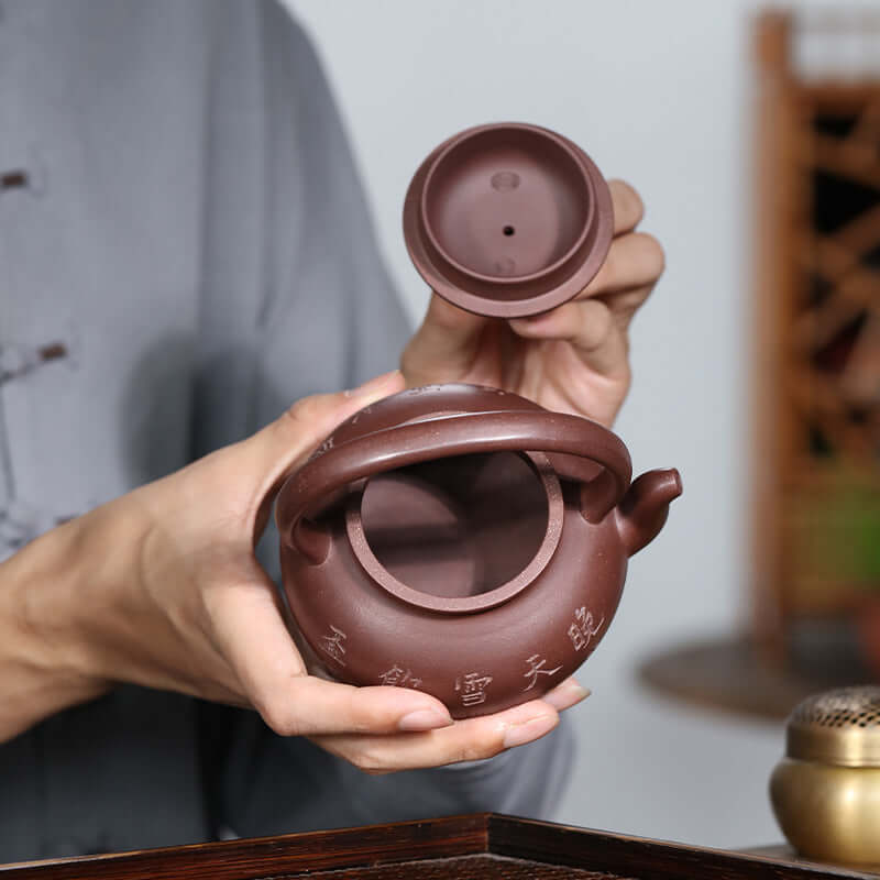 Handmade Yixing purple sand teapot with lid, showcasing unique craftsmanship and design, perfect for Kung Fu tea sessions.
