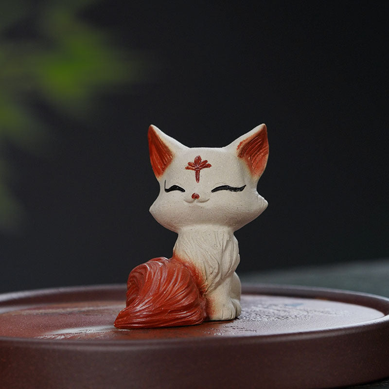 Handmade Yixing purple sand red nine-tailed fox ornament for tea ceremony, perfect as a tea pet or gift.