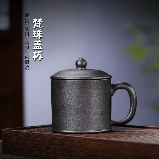 Handmade Yixing purple sand cup with lid, showcasing exquisite craftsmanship and a modern design for tea enthusiasts.