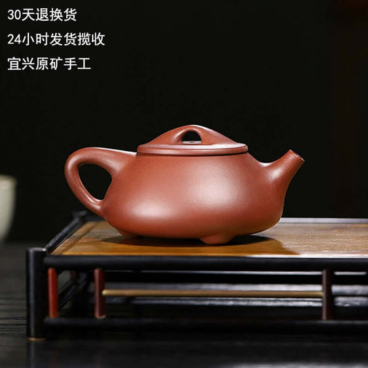 Handmade Yixing purple sand teapot, crafted from original purple sand by Yixing artisans, perfect for tea lovers.