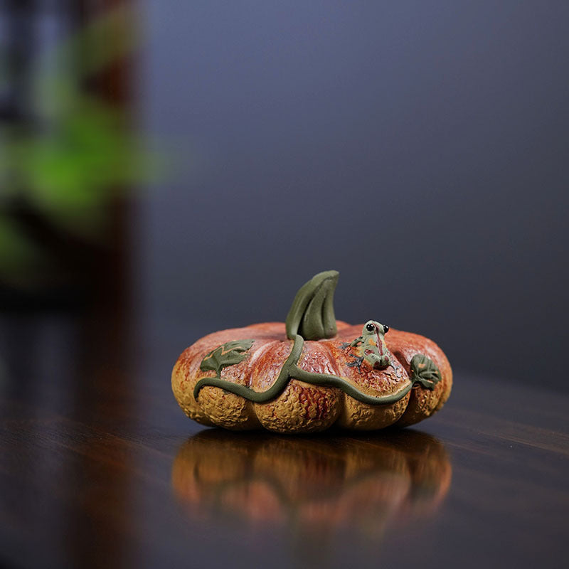 Handmade Yixing purple sand tea pet ornament featuring a cute frog atop a pumpkin, perfect for tea sets and decoration.