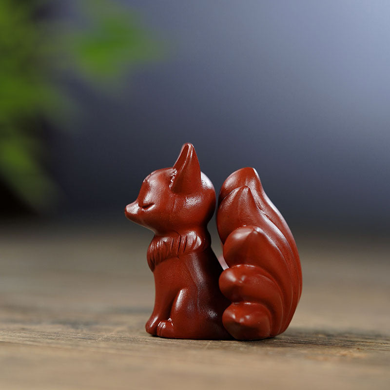 Handmade Yixing purple sand nine-tailed fox tea pet sculpture for tea table accessories.