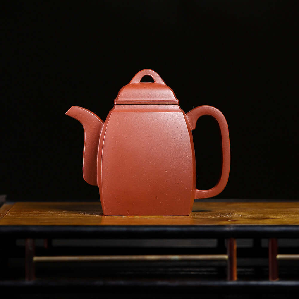 Handmade Yixing purple sand teapot in square shape, showcasing original craftsmanship and elegant design for tea enthusiasts.
