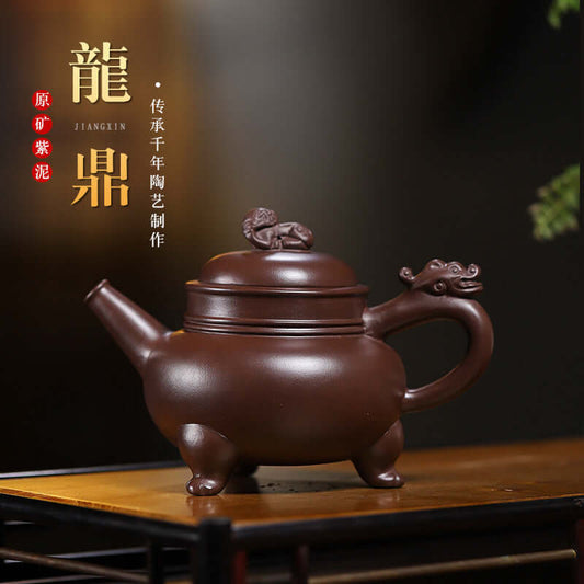 Handmade Yixing purple sand teapot by craftsman Jiangxin, featuring a dragon design and elegant craftsmanship.