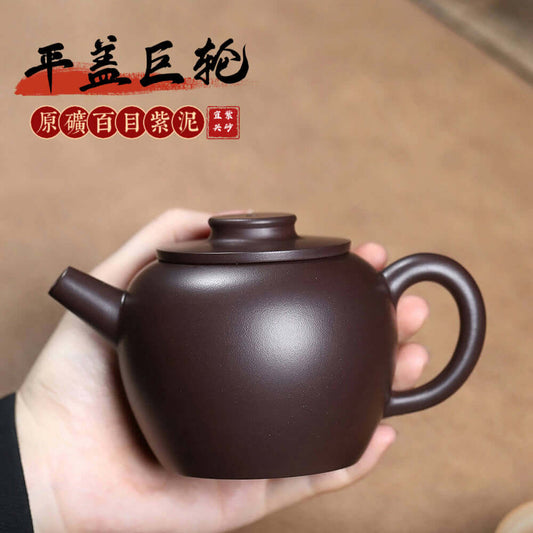 Handmade Yixing purple sand teapot with flat lid, showcasing traditional craftsmanship for home Kung Fu tea sets.
