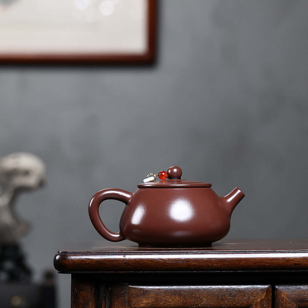 Handmade Yixing purple sand teapot with stone scoop, flat lid, perfect for Kung Fu tea brewing at home.