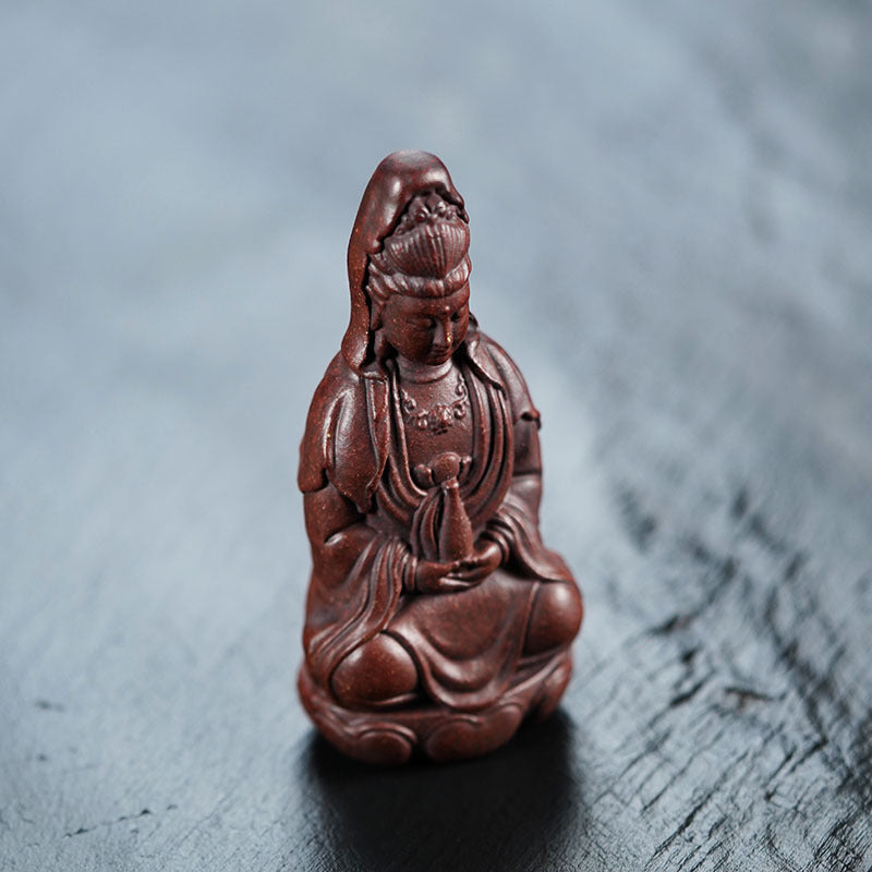 Handmade Yixing purple sand sculpture of Guanyin Bodhisattva, ideal for tea set and decoration.