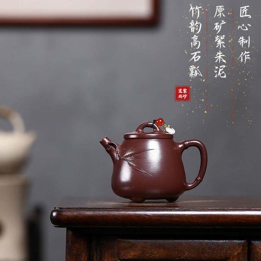 Handmade Yixing purple sand teapot with bamboo design, ideal for Kung Fu tea ceremonies, showcasing high-quality craftsmanship.