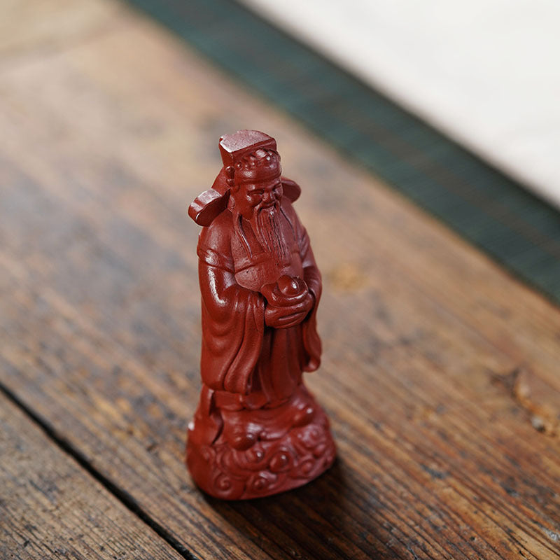 Handmade Yixing purple sand fortune sculpture, Red Robe God of Wealth ornament, ideal for tea sets and crafts.