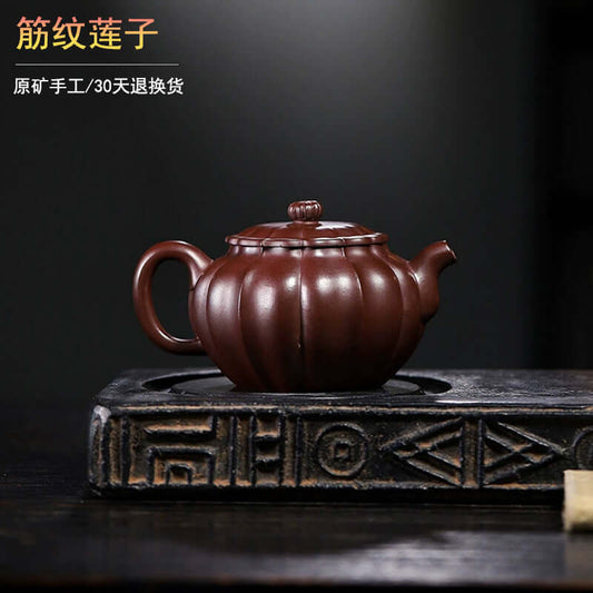 Handmade Yixing purple sand teapot with a unique ribbed design, showcasing traditional craftsmanship.