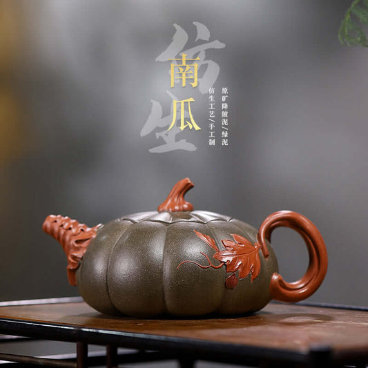 Handmade Yixing purple sand teapot shaped like a pumpkin, featuring detailed handle and leaf design.